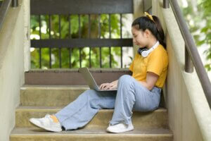 A student working on a laptop