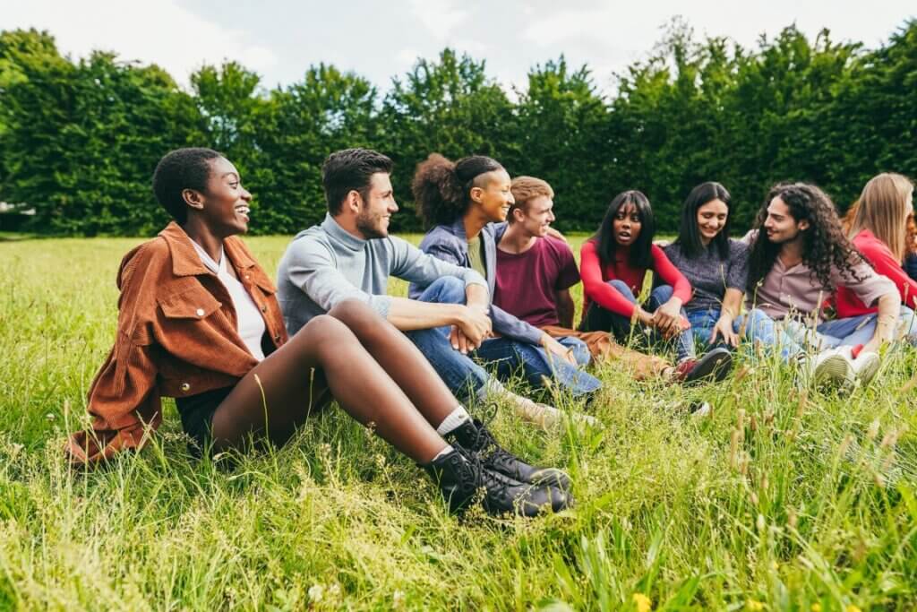 college class sitting in a field